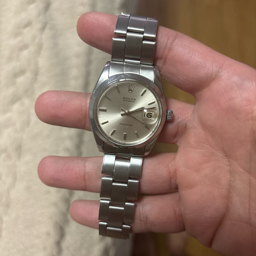 34 mens or women’s oyster precision Rolex with oyster strap and leather strap.